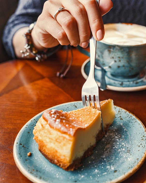 image of person sticking a fork in a piece of pie